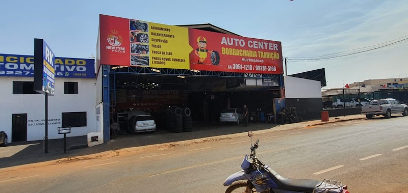 Logo Auto Center e Borracharia Tradição